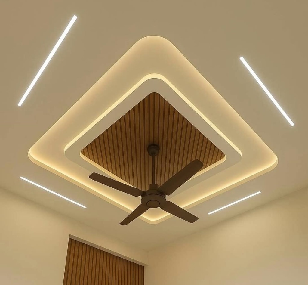 Geometric diamond wooden false ceiling with warm ambient lighting by Sharma Furniture