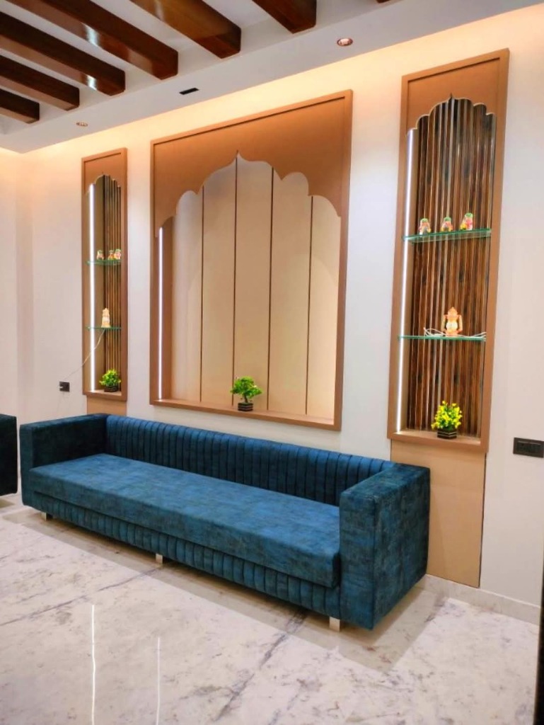 Royal arch wall niches and navy velvet sofa by Sharma Furniture