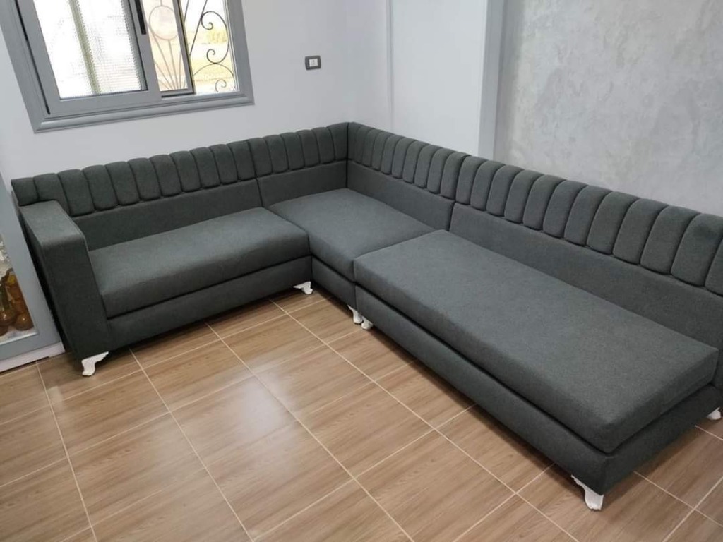 Contemporary charcoal grey fluted sectional sofa with curved channel backrest by Sharma Furniture