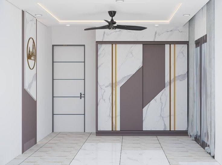 Marble texture and gold trim sliding wardrobe by Sharma Furniture